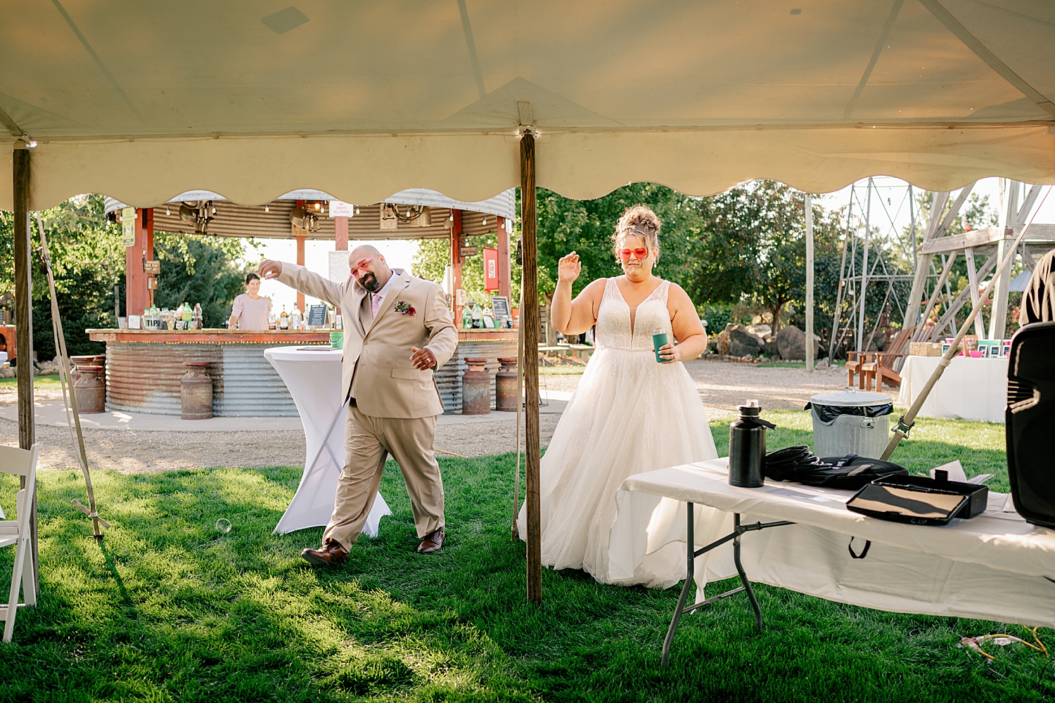 newlyweds enter tented reception at Historic Deglman Farm