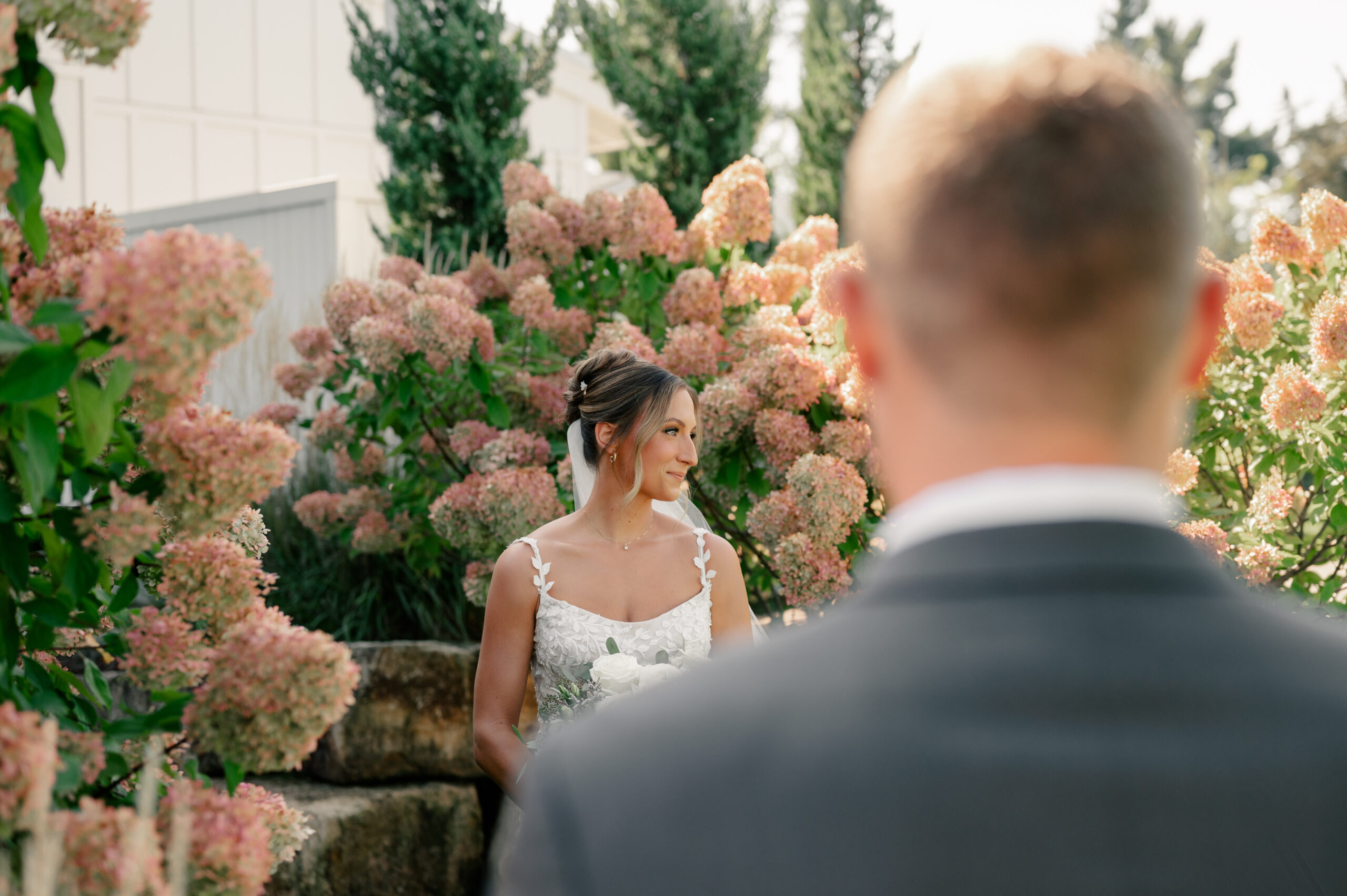 groom looks at bride lovingly by Minnesota wedding photographer