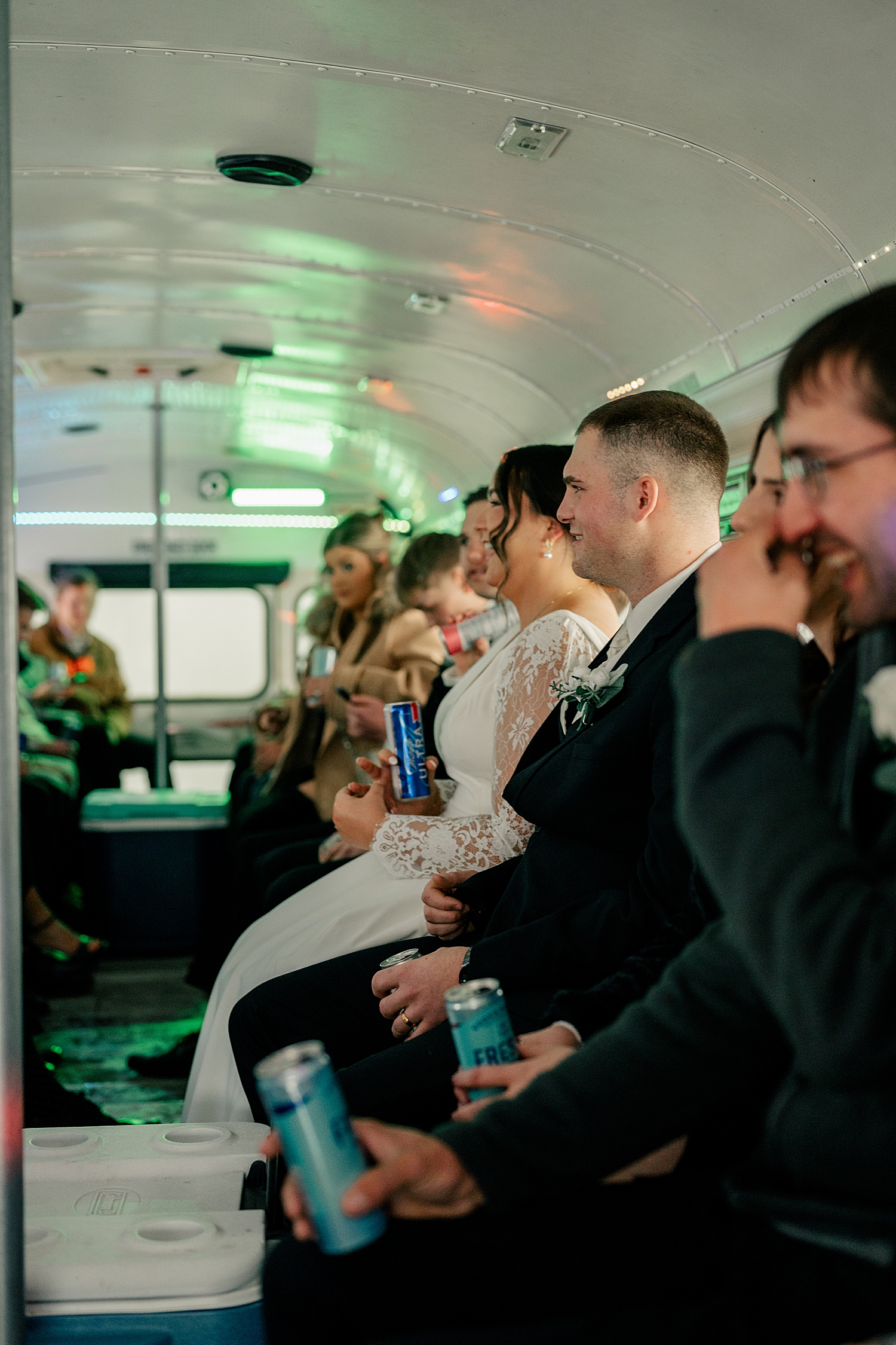 bridal party and groomsmen on party bus by Rule Creative Co
