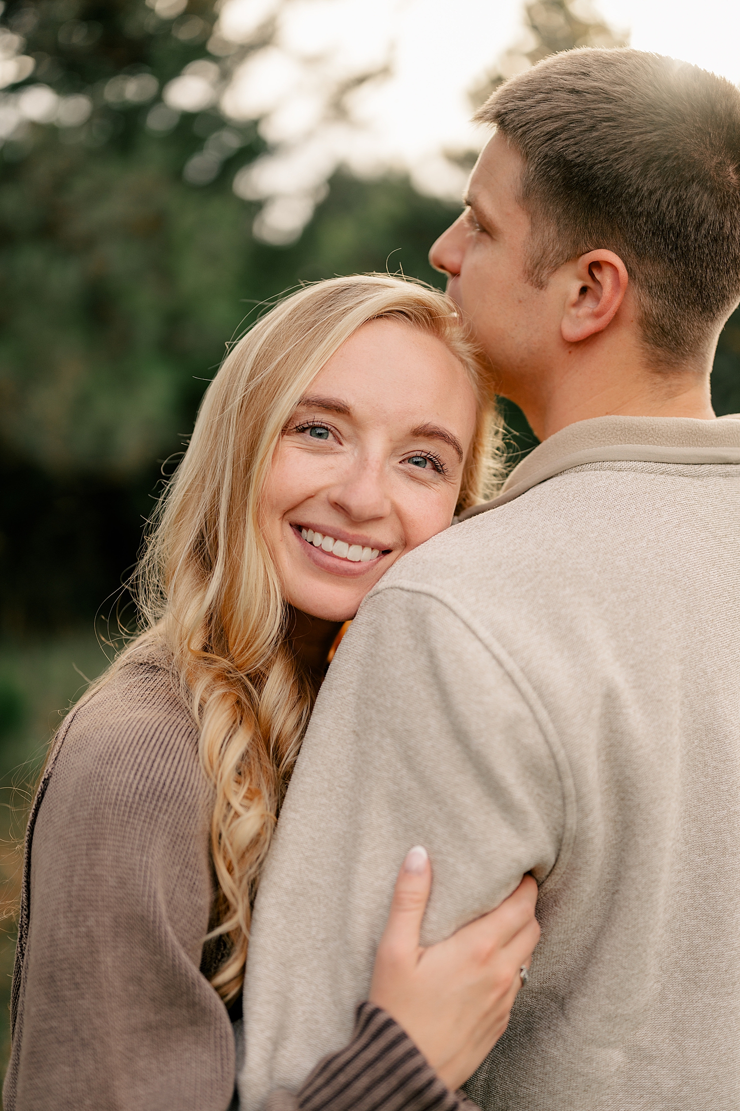 blonde leans against her fiance's shoulder by Rule Creative Co