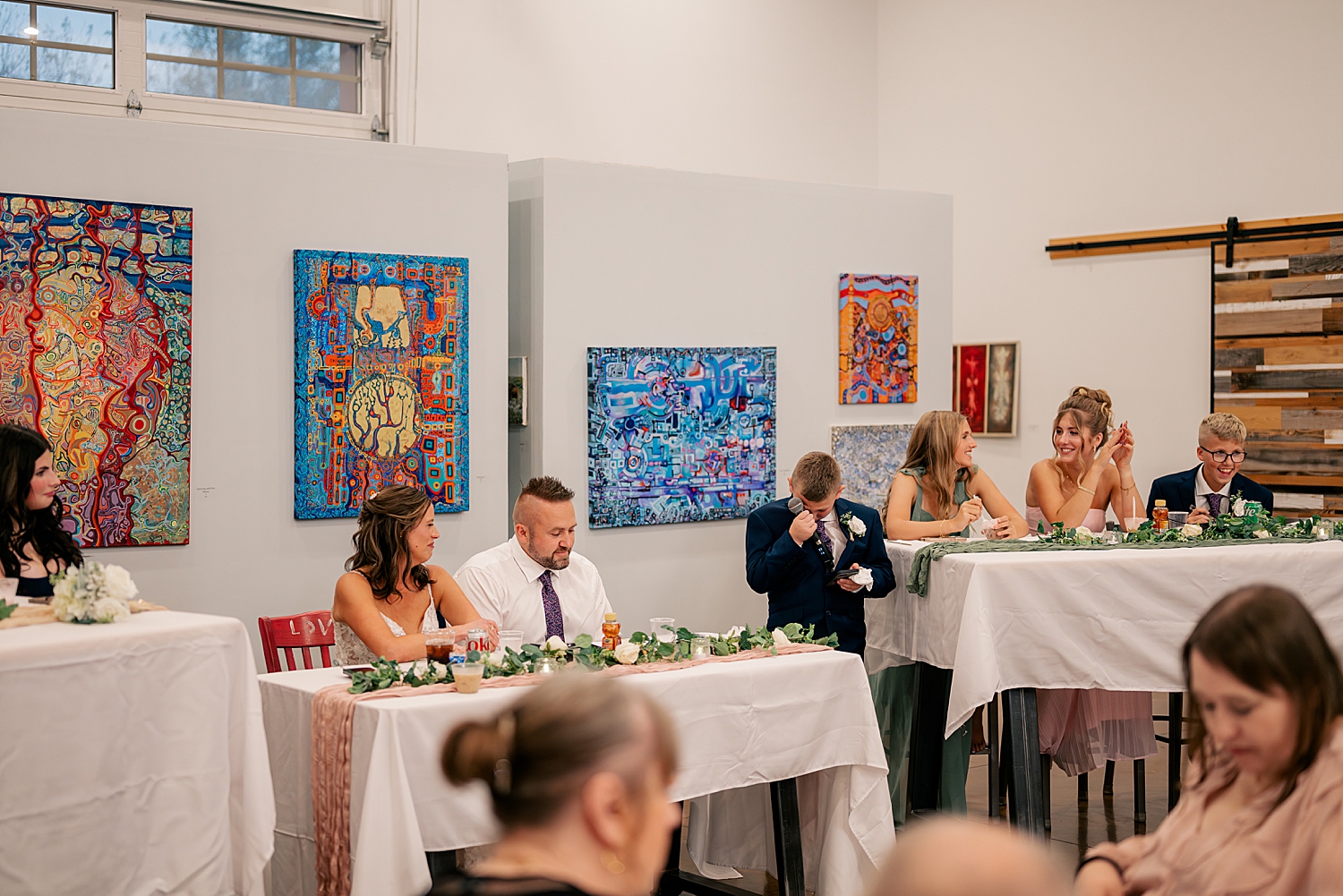 small son cries during toast at Art in Motion