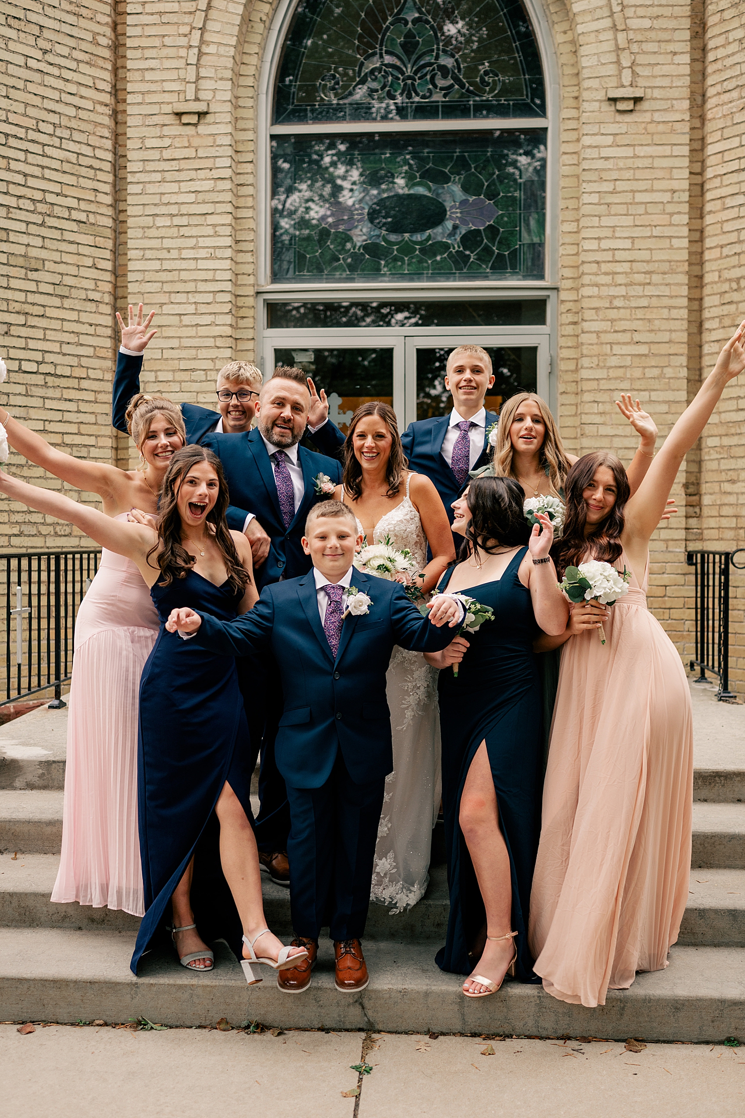 group of people together on church steps showing how to work through family formals quickly