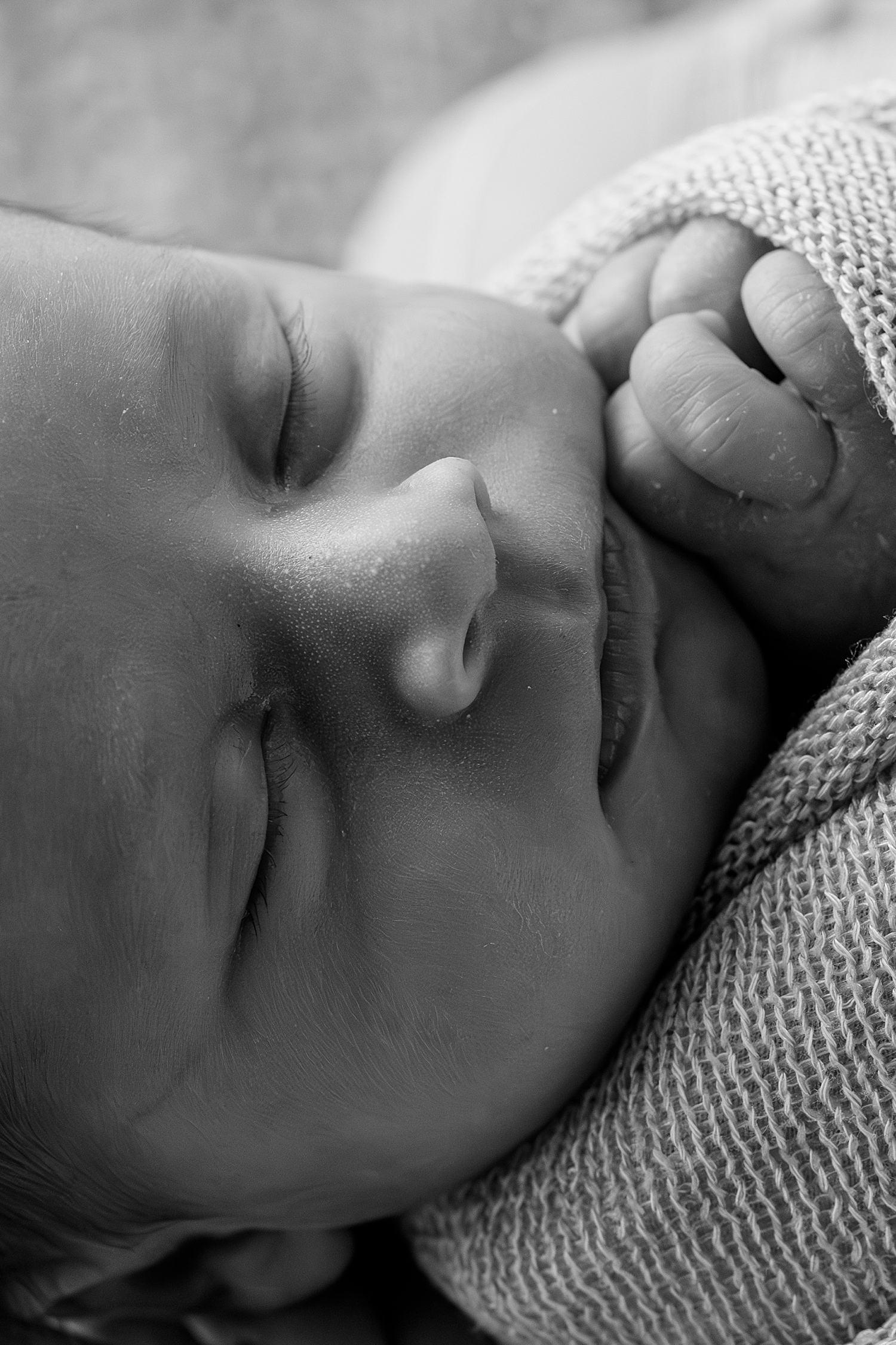 small infant wrapped up tightly at studio by Rule Creative Co