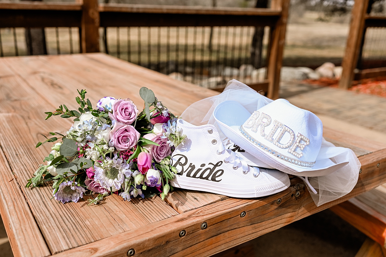 bride's shoes and hat on a picnic table by MN Elopement Photographer