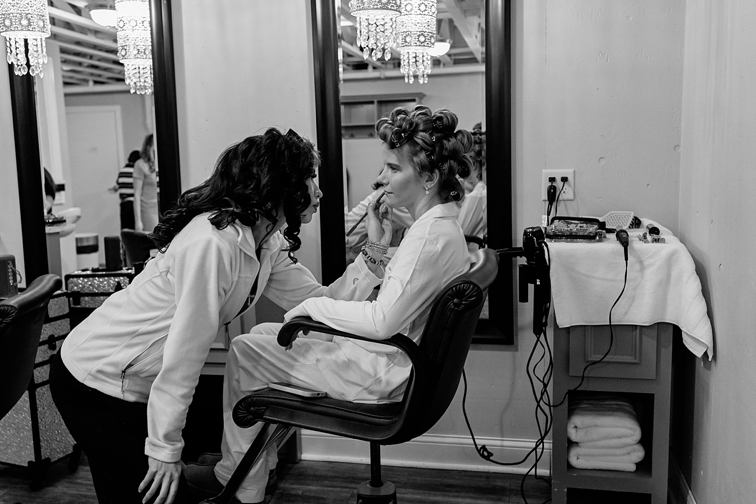 bride gets her makeup done in chair by Rule Creative Co