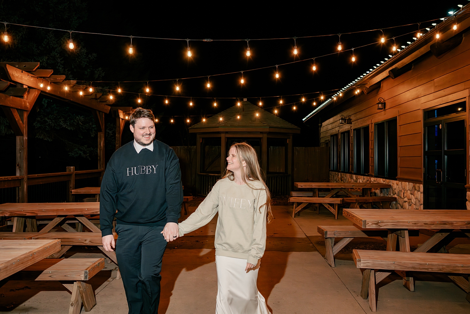 bride and groom change into sweatshirts at reception by MN Elopement Photographer
