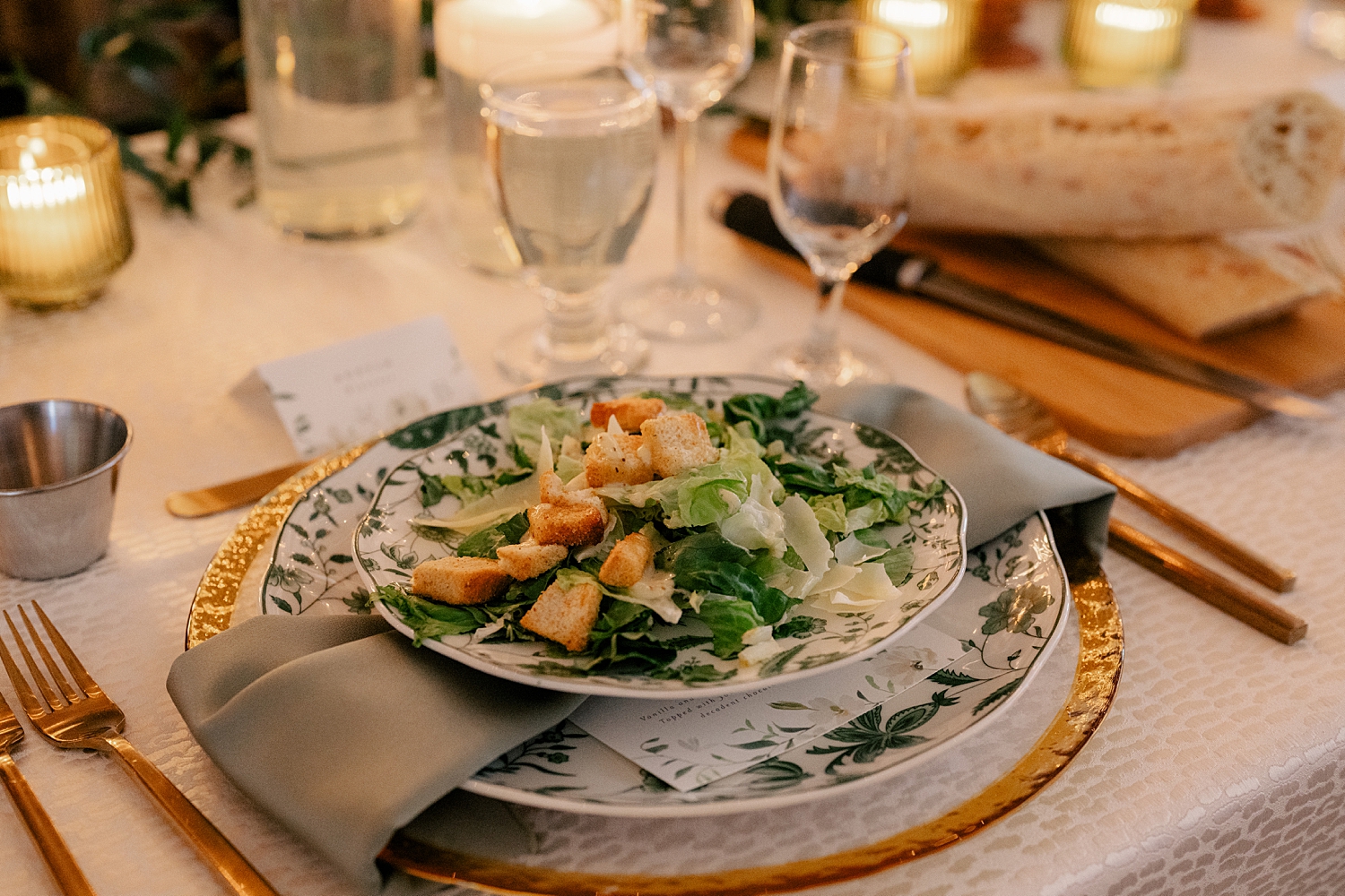 salad on plated dinner tablle by Minnesota wedding photographer
