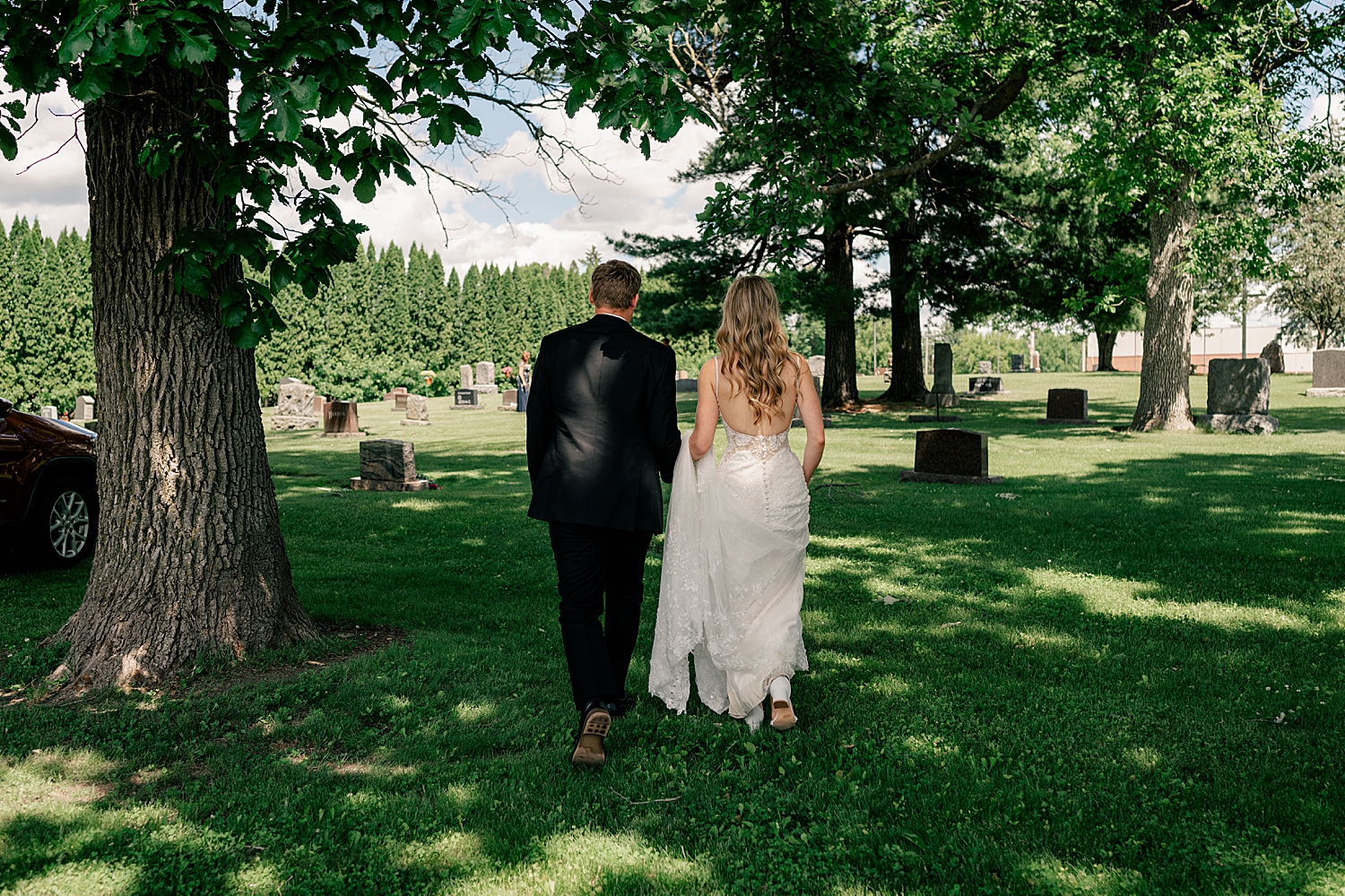 bride and groom approach cemetery before big day at at Shady's Sunset Bay 