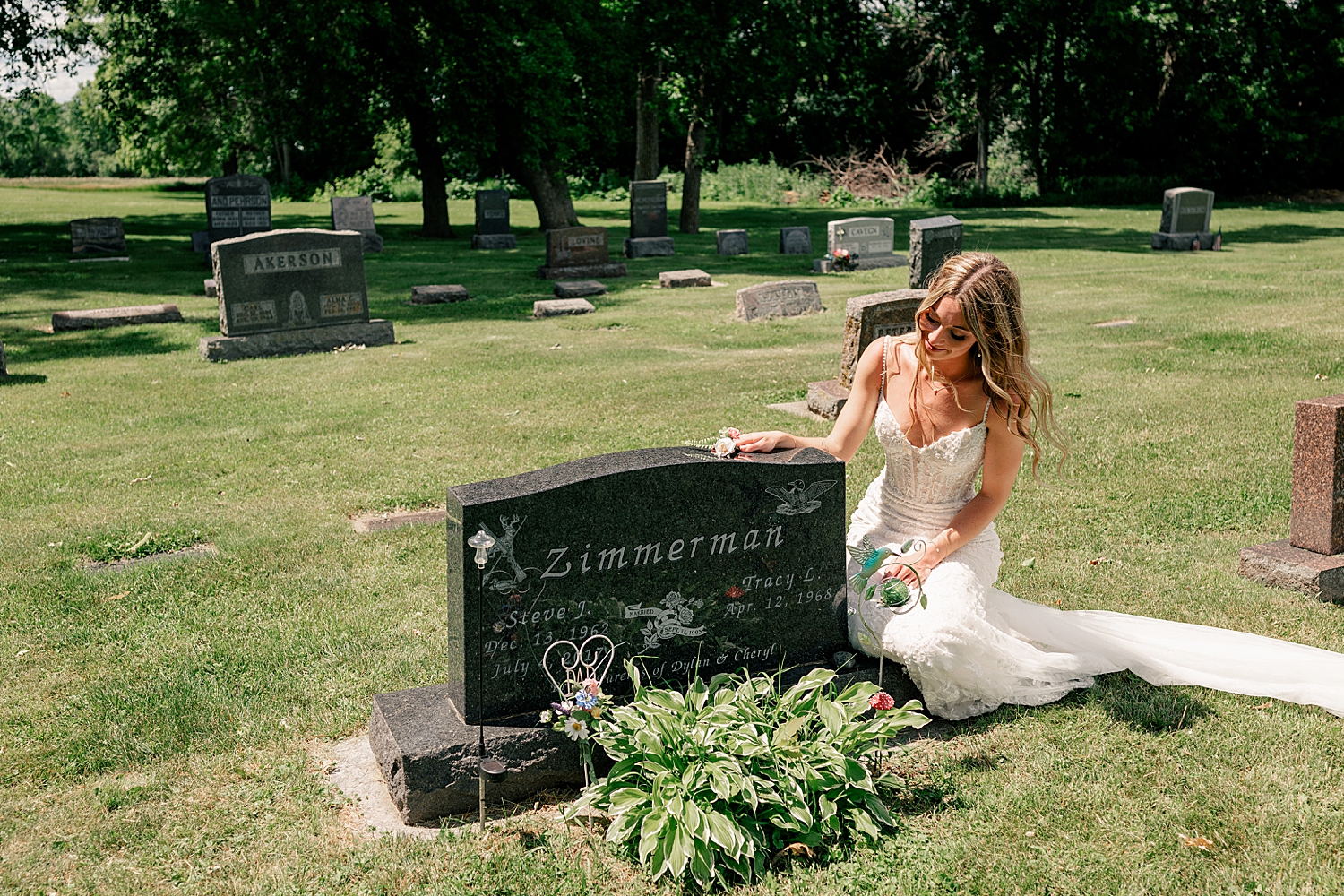 bride puts her hand on tombstone by Rule Creative Co