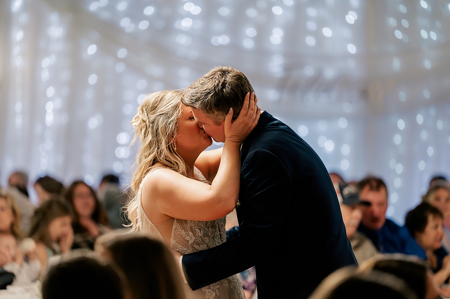 newlyweds kiss on the dance floor at The Olde Coliseum